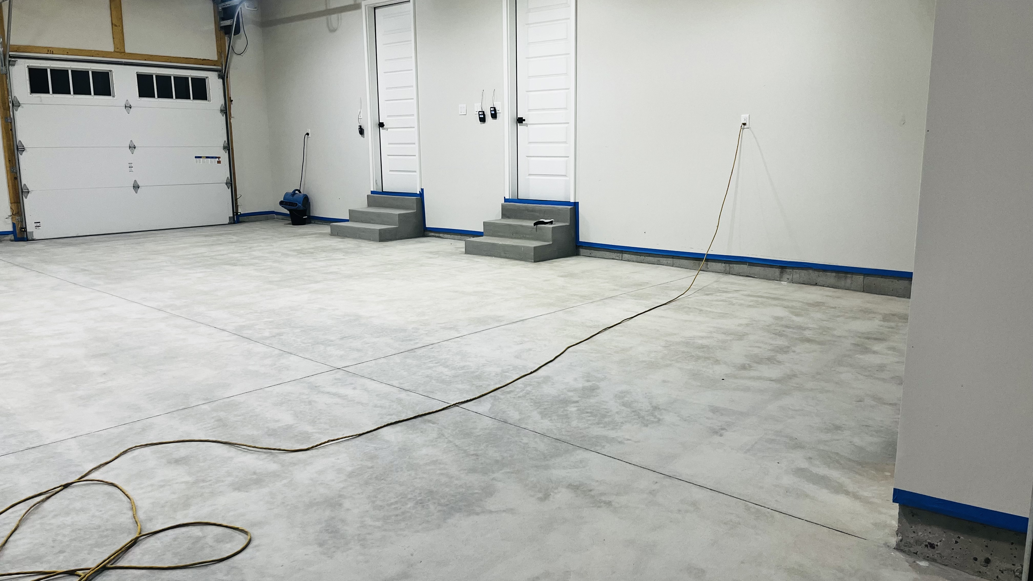 Bare concrete garage floor before epoxy coating